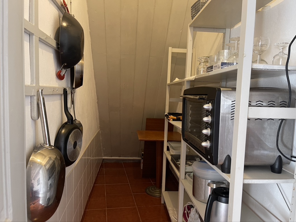 The pantry, next to the table in the kitchen